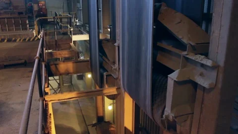 In the workshop, a conveyor belt moves vertically, continuously. Stock Footage 122214249