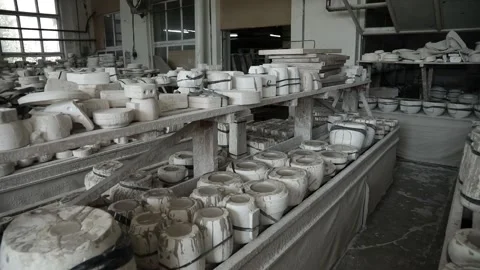 Workshop. Earthenware baking pans stand on wooden shelves. Video stock 130526500