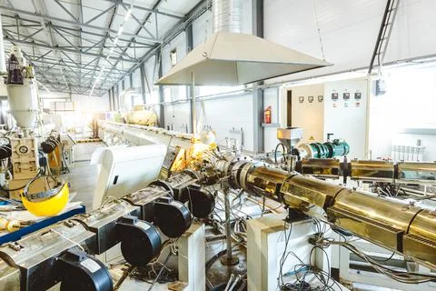 Workshop with extruders for producing plastic pipes. High speed extrusion line Stock Photos