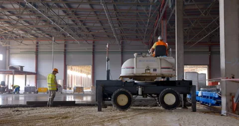 In workshop industrial leveler makes a concrete floor of a large area Stock Footage 161988889