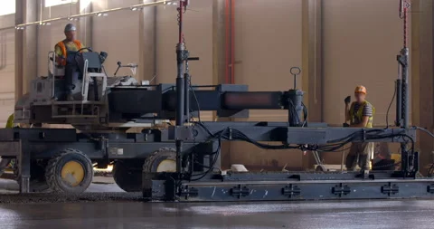 In workshop industrial leveler makes a concrete floor of a large area Stock Footage 161990073