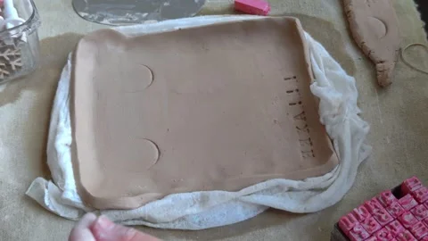 Workshop for kids. Children learning how to use clay for making dishes. Stock-Footage 292828505