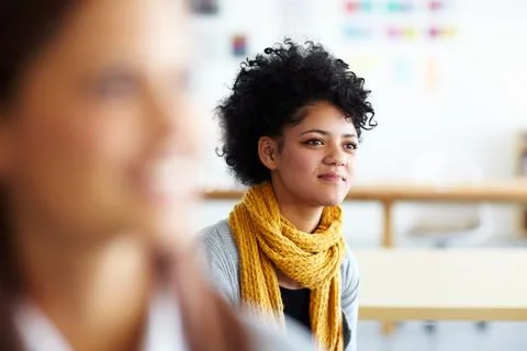 Workshop, learning and creative woman listening in office for meeting Stock Photos
