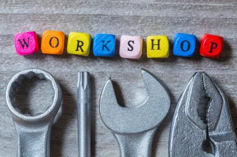 Workshop letter cube and tool on gray wood visualization Stock Photos