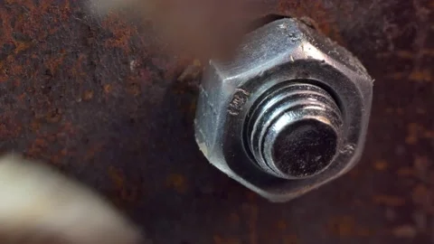Workshop, locksmith work. The master unscrews the nut with pliers and fingers. Video stock 151438055