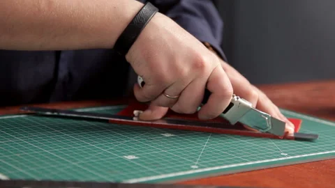 In the workshop, a man glues the workpieces of the skin, making a wallet Stock Footage 88833953