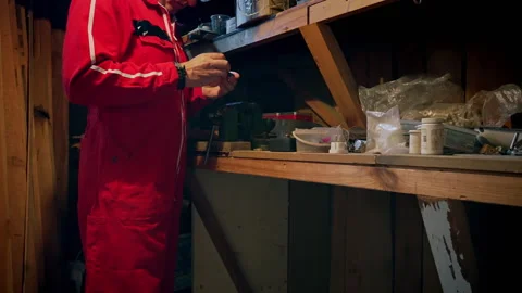 In a workshop, a man uses a vice. Stock Footage 318588096