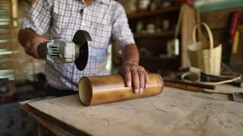 Workshop man working with bamboo tree branch making craft Stock Footage 248830254