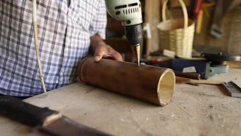 Workshop man working with bamboo tree branch making craft Stock Footage 248830261