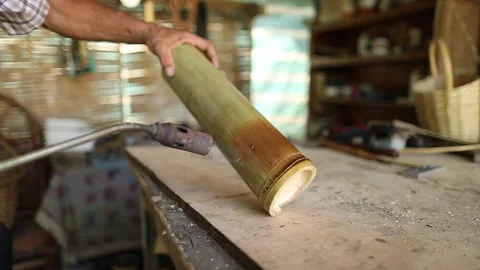 Workshop man working with bamboo tree branch making craft Stock Footage 248830426