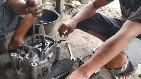 Workshop mechanic repairing a machine Stock Footage 238816310