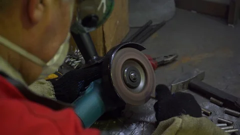 Workshop, processing small parts, circular saw processes metal cylinders Stock Footage 120064546
