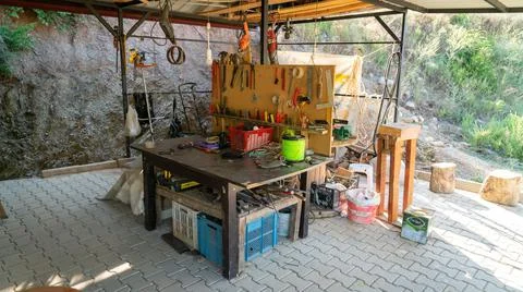 Workshop scene with many tools on the table and board. Stock Photos
