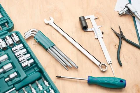 Workshop table with many tools. Wrench, spanner, calliper and ratchet with .. Stock Photos