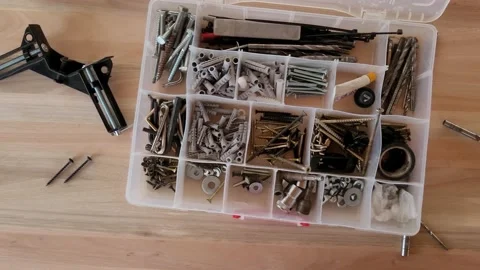 Workshop table with an open toolbox full of hardware. Tracking shot Stock Footage 218383891