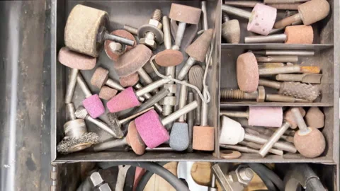 Workshop toolbox with assorted rotary tools, grinding bits, grinding stones.. Stock Footage 344906597
