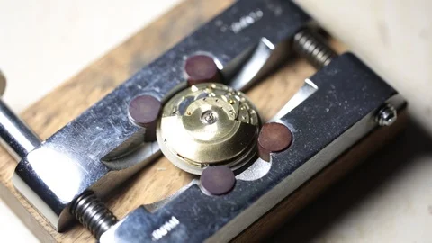 Workshop watchmaking screwing automatic watch movement Stock Footage 98424282