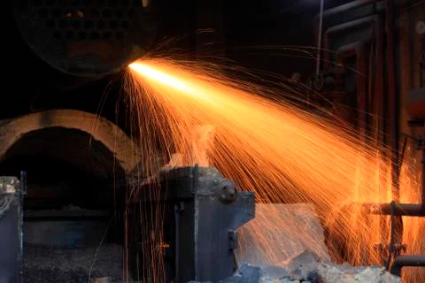 The workshop welder cuts metal Stock Photos