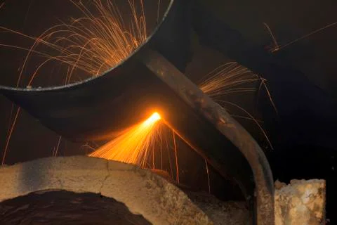 The workshop welder cuts metal Stock Photos