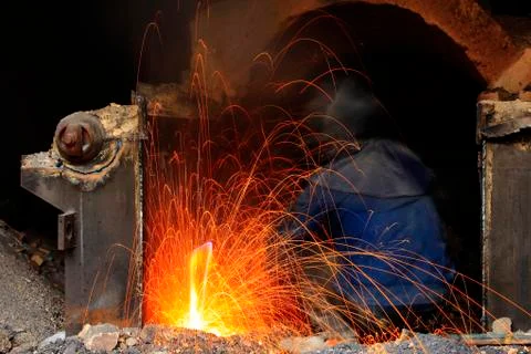The workshop welder cuts metal Stock Photos