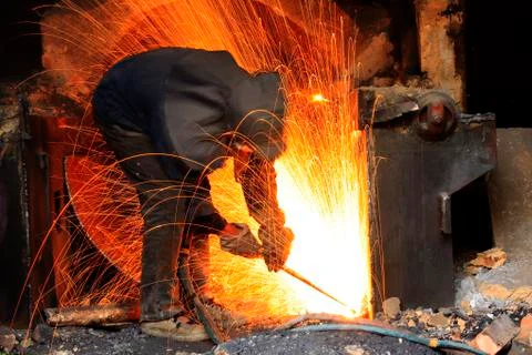 The workshop welder cuts metal?? Stock Photos