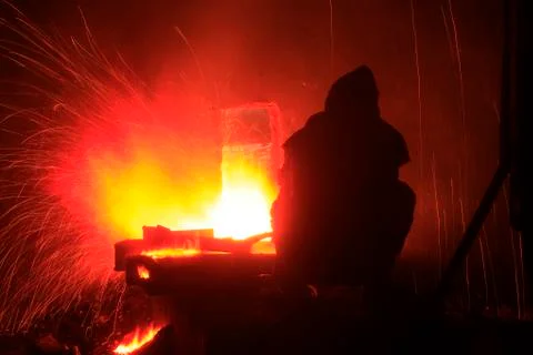 The workshop welder cuts metal Stock Photos