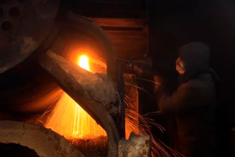 The workshop welder cuts metal Stock Photos