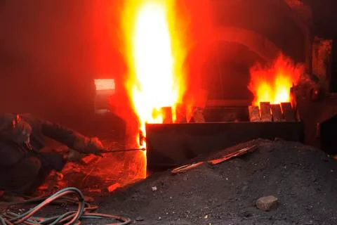 The workshop welder cuts metal Stock Photos