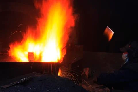 The workshop welder cuts metal Stock Photos