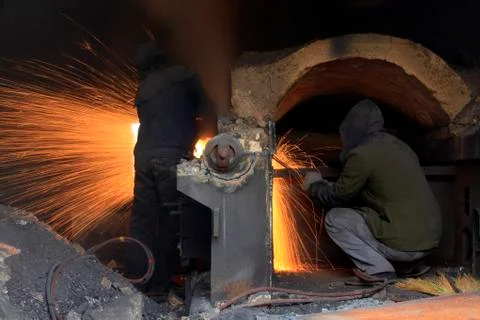 The workshop welder cuts metal?? Stock Photos