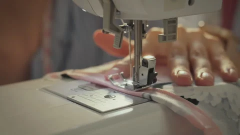 Workshop. White Asian woman using sewing machine while developing collection 스톡 동영상 283685535