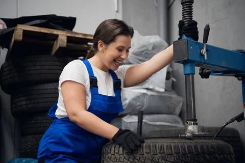 Workshop worker enjoys working on a machine tool Stock Photos