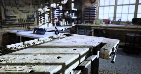 Workshop workspace with tools and materials during afternoon light Stock Illustration