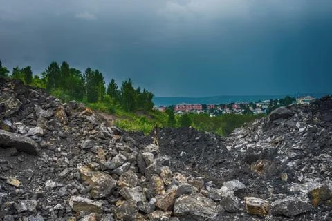 Worksite and trees with cloudy sky in Novokuznetsk Stock Photos