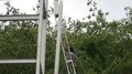 Worksman working unsecured on erection of scaffolding for new hotel building in 4k or 4k+ Resolution