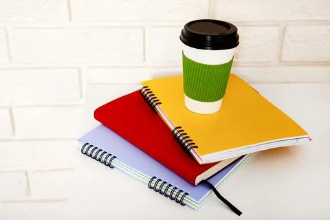 Workspace and education accessories on the table. Cup of coffee, books, gla.. Foto stock