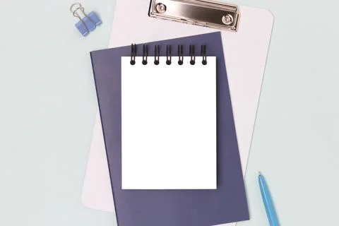 Workspace with clean notepad mockup and stationery. Stock Photos