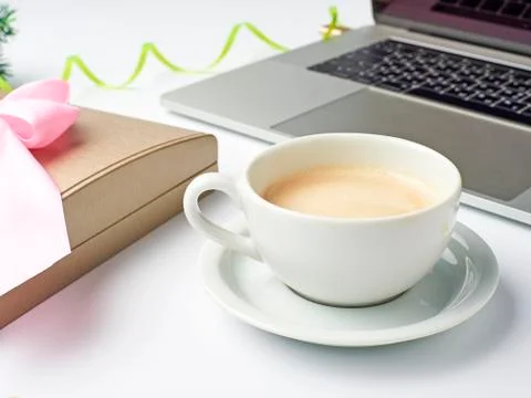 Workspace with coffee Cup, notebook, gift box and Christmas decorations on a  Stock Photos