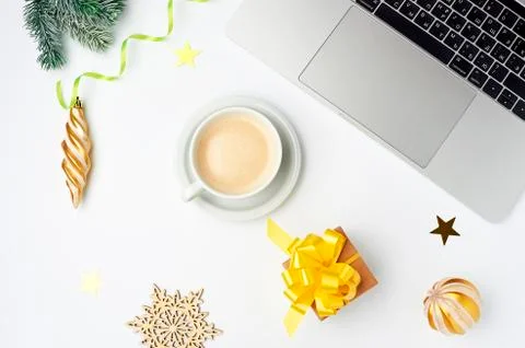 Workspace with coffee Cup, notebook, gift box and Christmas ornaments. Stock Photos