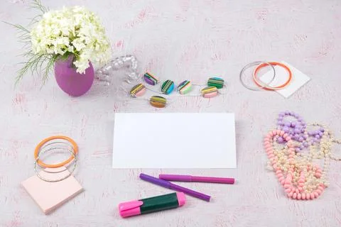 Workspace with computer, bouquet Hydrangeas, clipboard. Women's fashion acc.. Stock Photos