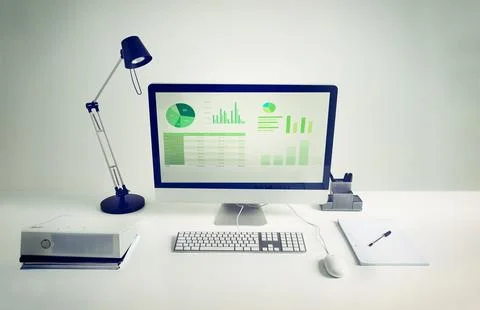 Workspace, computer screen and notebook in room with light for remote work Stock Photos