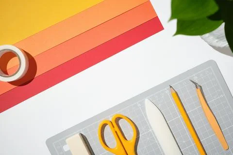 Workspace for DIY projects. Orange stationery and craft supplies on white b.. 스톡 사진