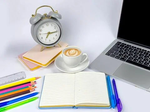 Workspace Essentials You Need Coffee Brewing, a Functional Clock, and Creat.. Stock Photos