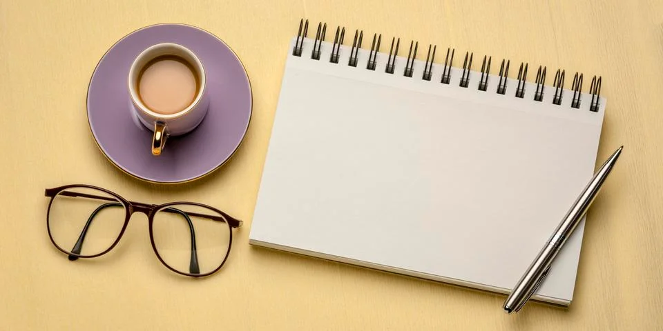 Workspace flat lay with blank notebook Stock-Fotos