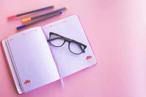 Workspace. Glasses and a notebook. Stock-Fotos