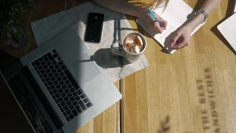 Workspace with Hand touch keyboard on laptop computer, notebook, sandwiches in Stock Footage