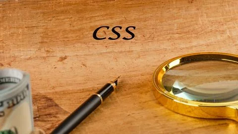 A workspace highlighting technology concepts, emphasizing CSS with a pen and  스톡 사진