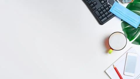 Workspace with keyboard, notepad and a cup of cappuccino coffee Foto stock