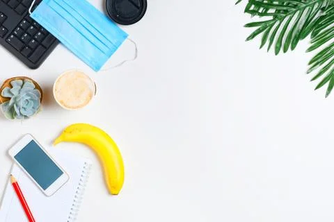 Workspace layout with keyboard, notepad and cappuccino coffee cup and flower Stock Photos