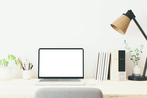 Workspace with mockup blank screen laptop computer. Stock Photos